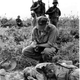 Chaplain John McNamara of Boston makes the sign of the cross as he administers the last rites to photographer Dickey Chapelle in South Vietnam Nov. 4, 1965. Chapelle was covering a U.S. Marine unit on a combat operation near Chu Lai for the National Observer when she was seriously wounded, along with four Marines, by an exploding mine. She died in a helicopter en route to a hospital. (AP Photo/Henri Huet)